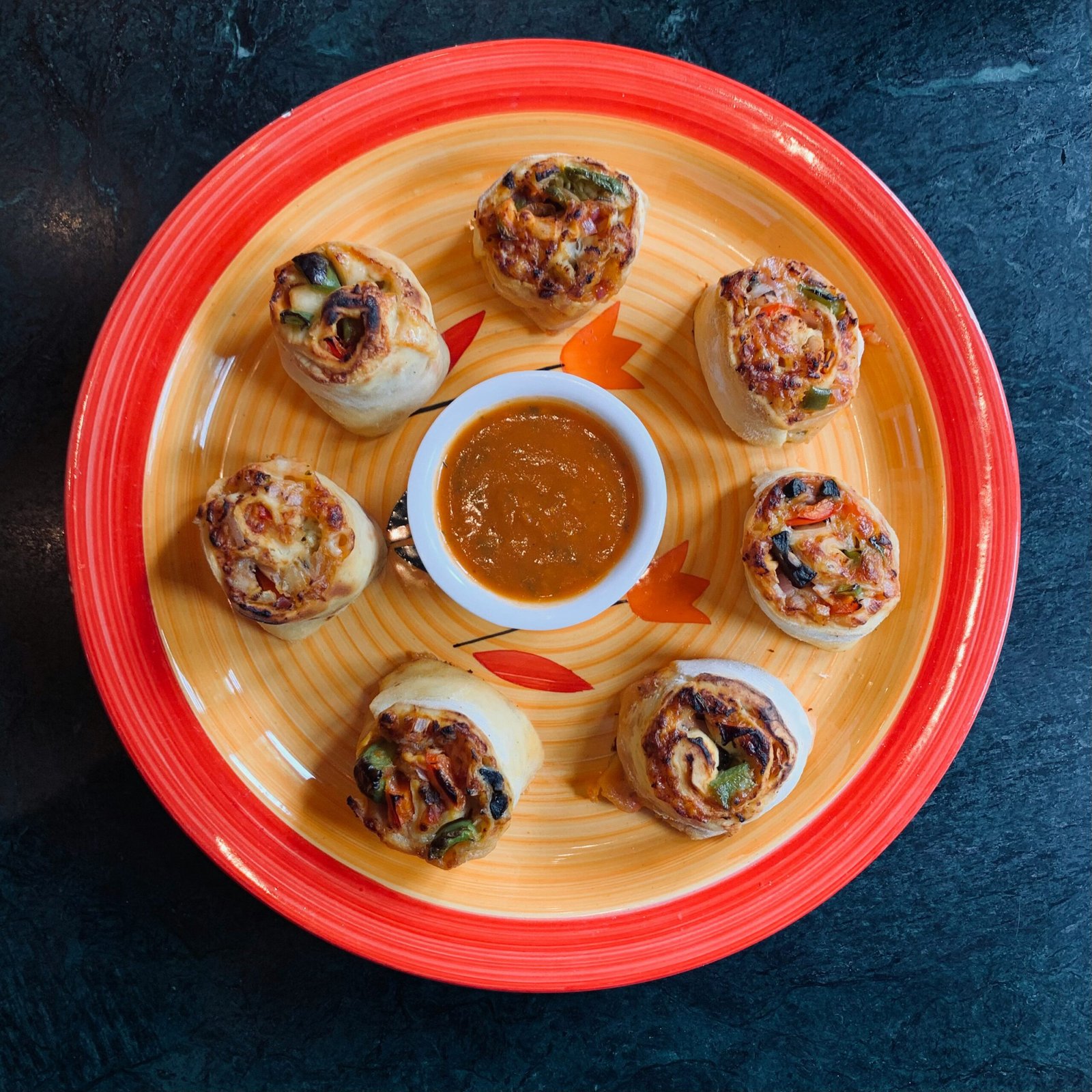 six cupcakes on red round plate